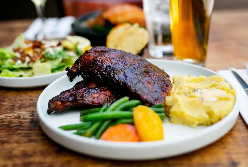 bbq ribs with potatoes and vegetables